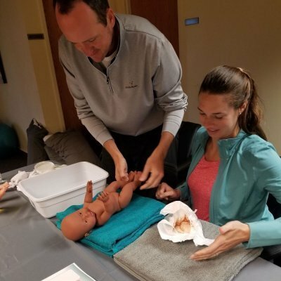 couple changing diaper